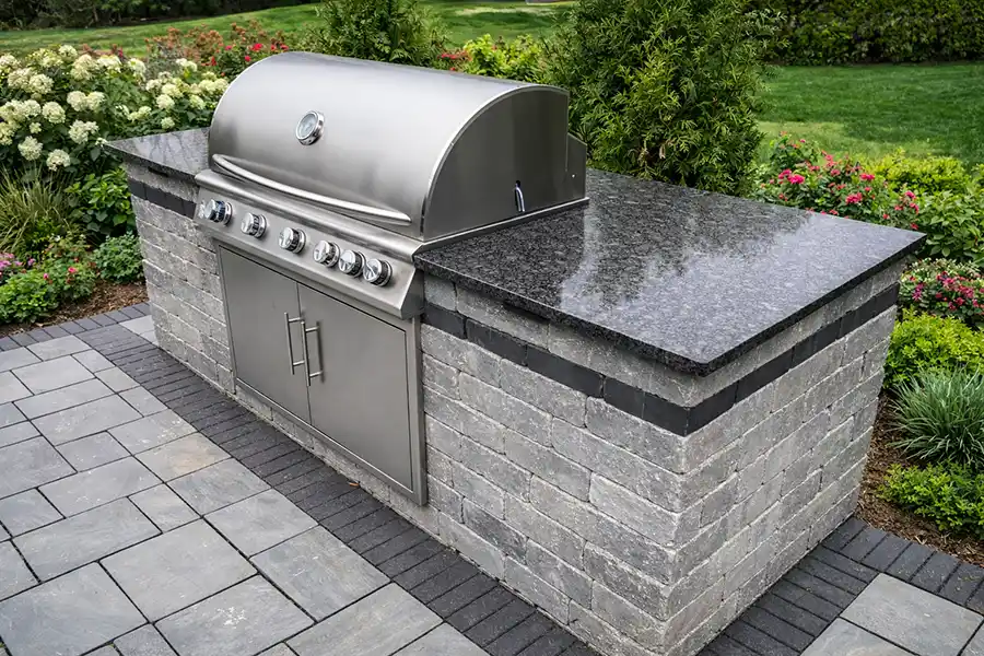 Custom outdoor kitchen with granite countertops and grill