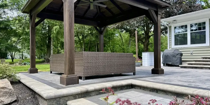 custom mocha pavilion with black metal roof New Albany Ohio Berlin Gardens Cascade pavilion over Unilock paver patio New Albany Ohio