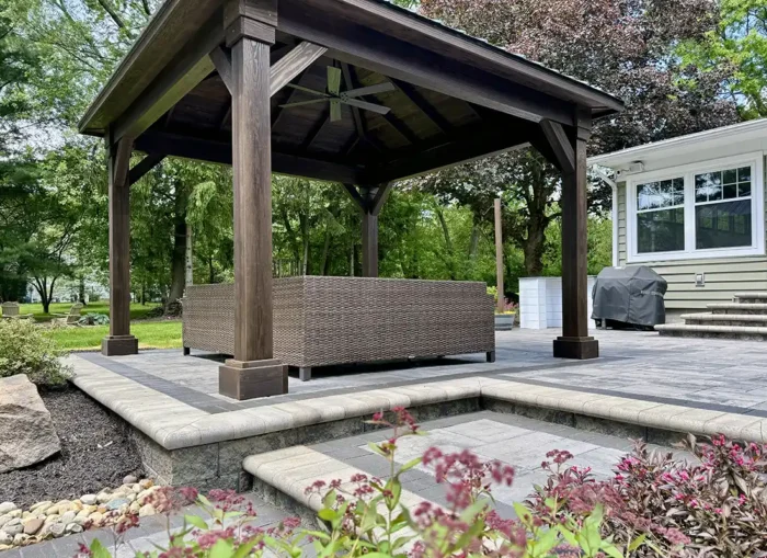 custom mocha pavilion with black metal roof New Albany Ohio Berlin Gardens Cascade pavilion over Unilock paver patio New Albany Ohio